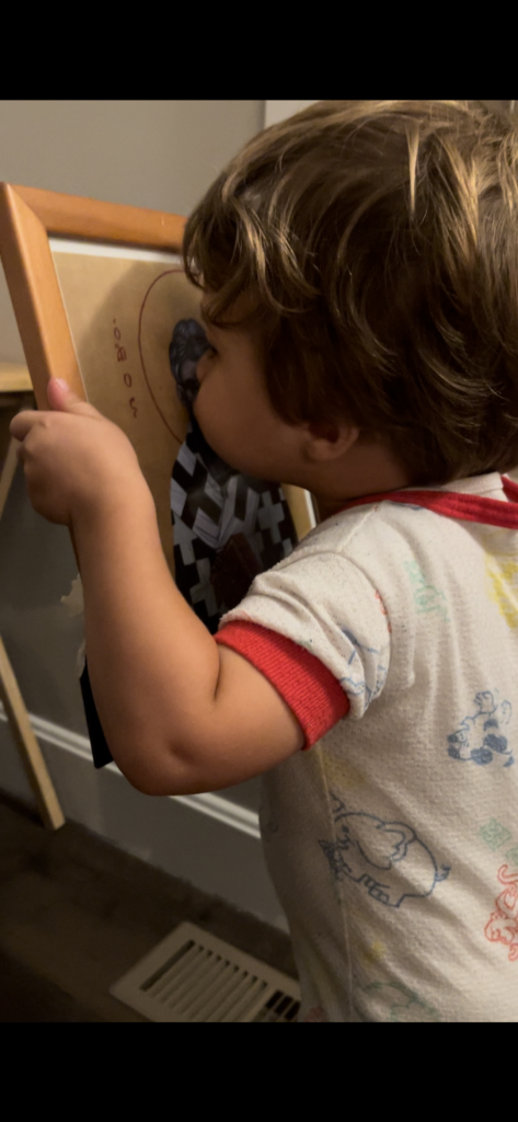 child kissing icon of St. Augustine of Hippo as part of liturgical living